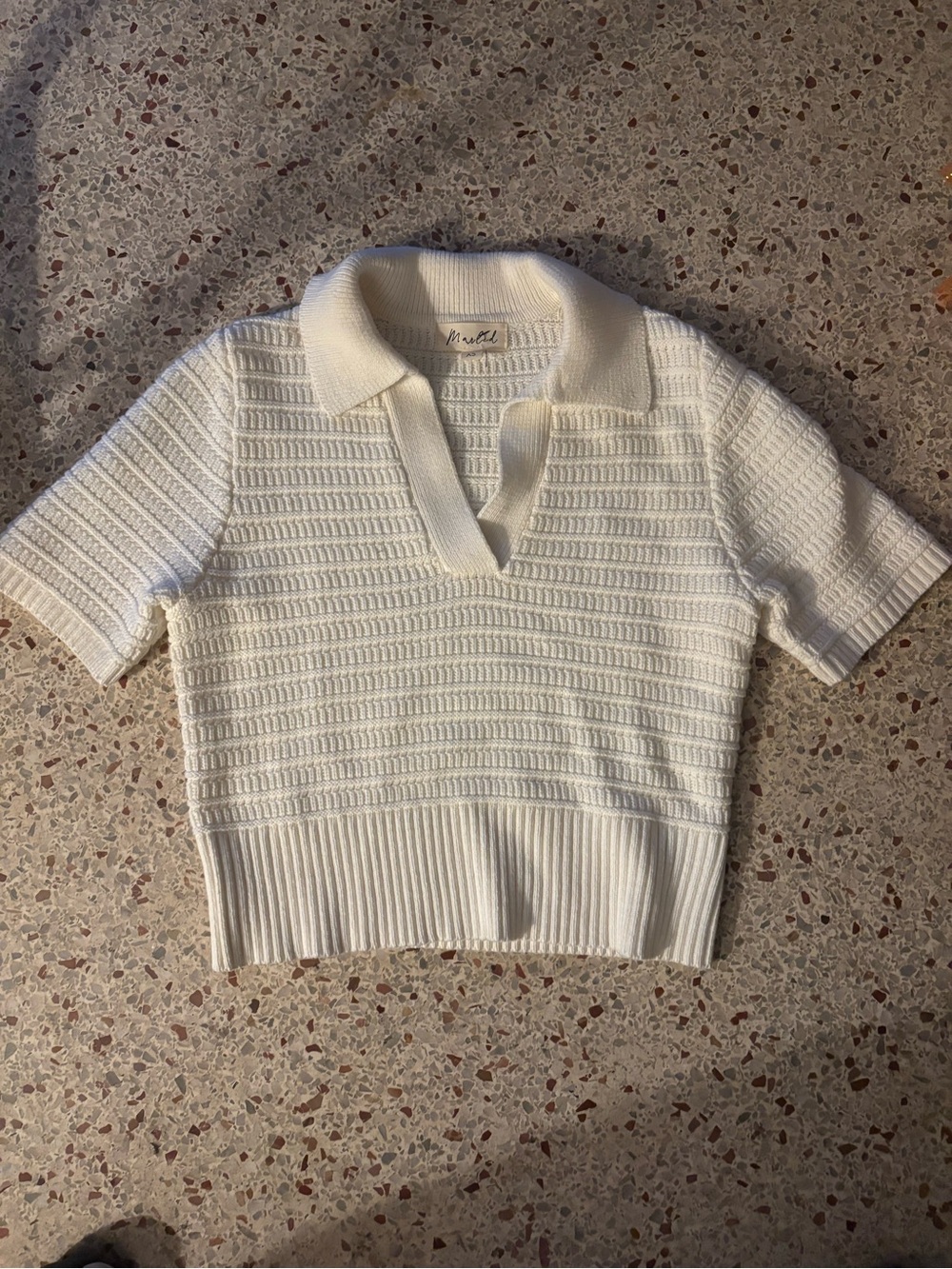 Marled by Anthropologie short-sleeve polo sweater, likely in a cream or white